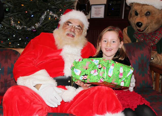 Children's Christmas Party at 8-100. 12-9-2012. Santa pays a visit . Photo by Vincent P. Tuzzolino